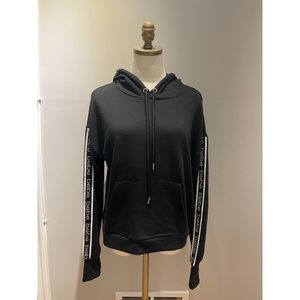 New Black Bebe hooded sweatshirt with weighted charms drawstrings.